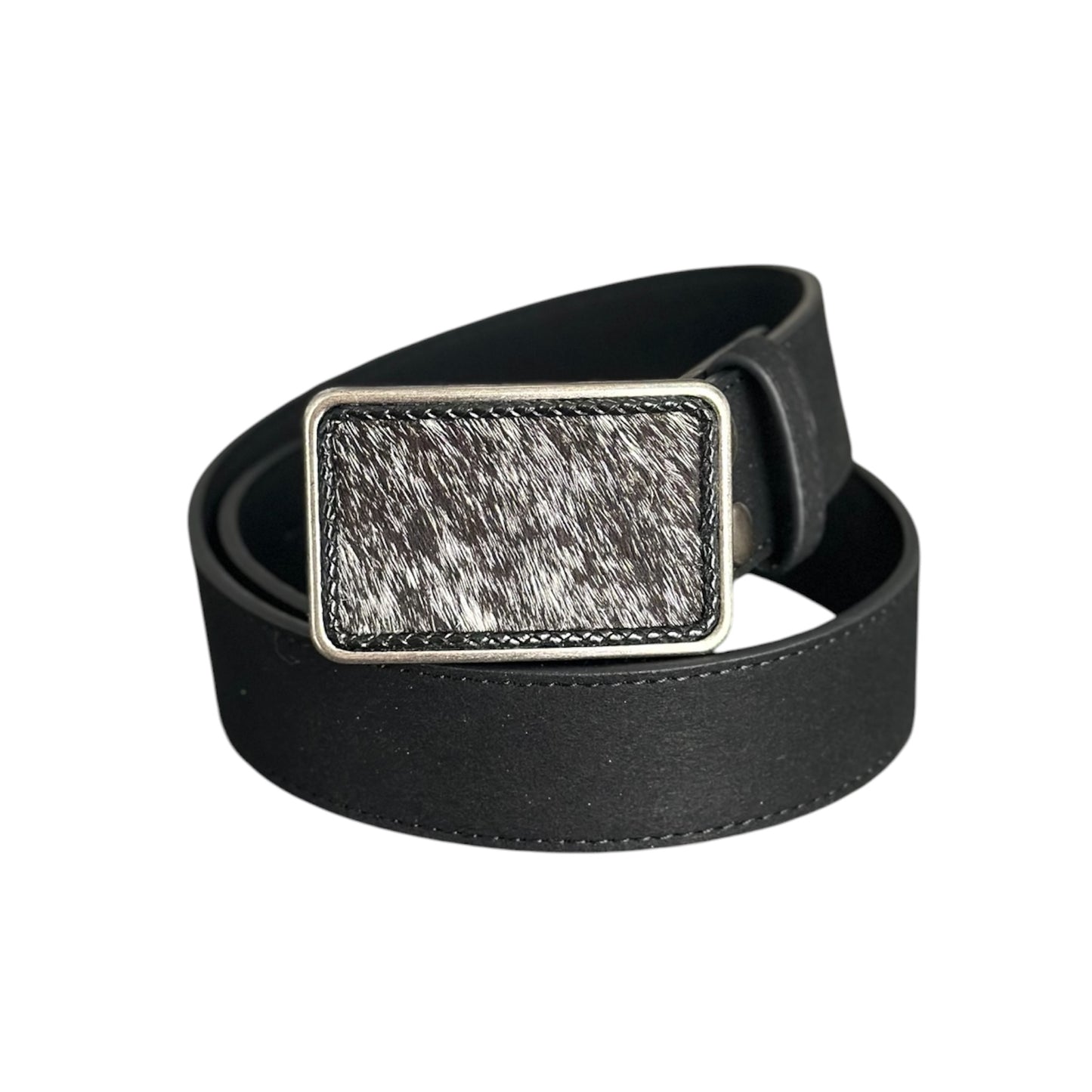 A black suede belt with a rectangular silver-tone metal buckle and a hair on hide black and white cowhide inlay, on a white background.