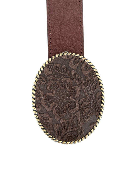 A dark brown floral embossed leather belt buckle with an antique brass finish.