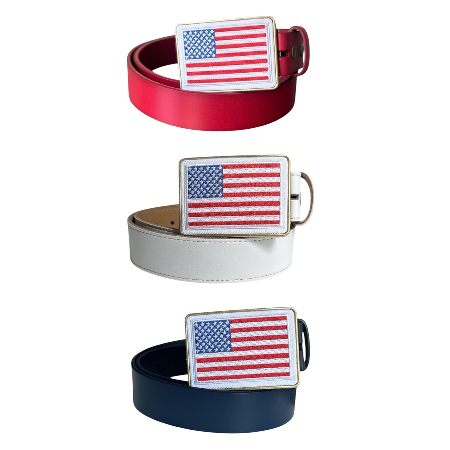 Three belts with American flag buckles on a white background