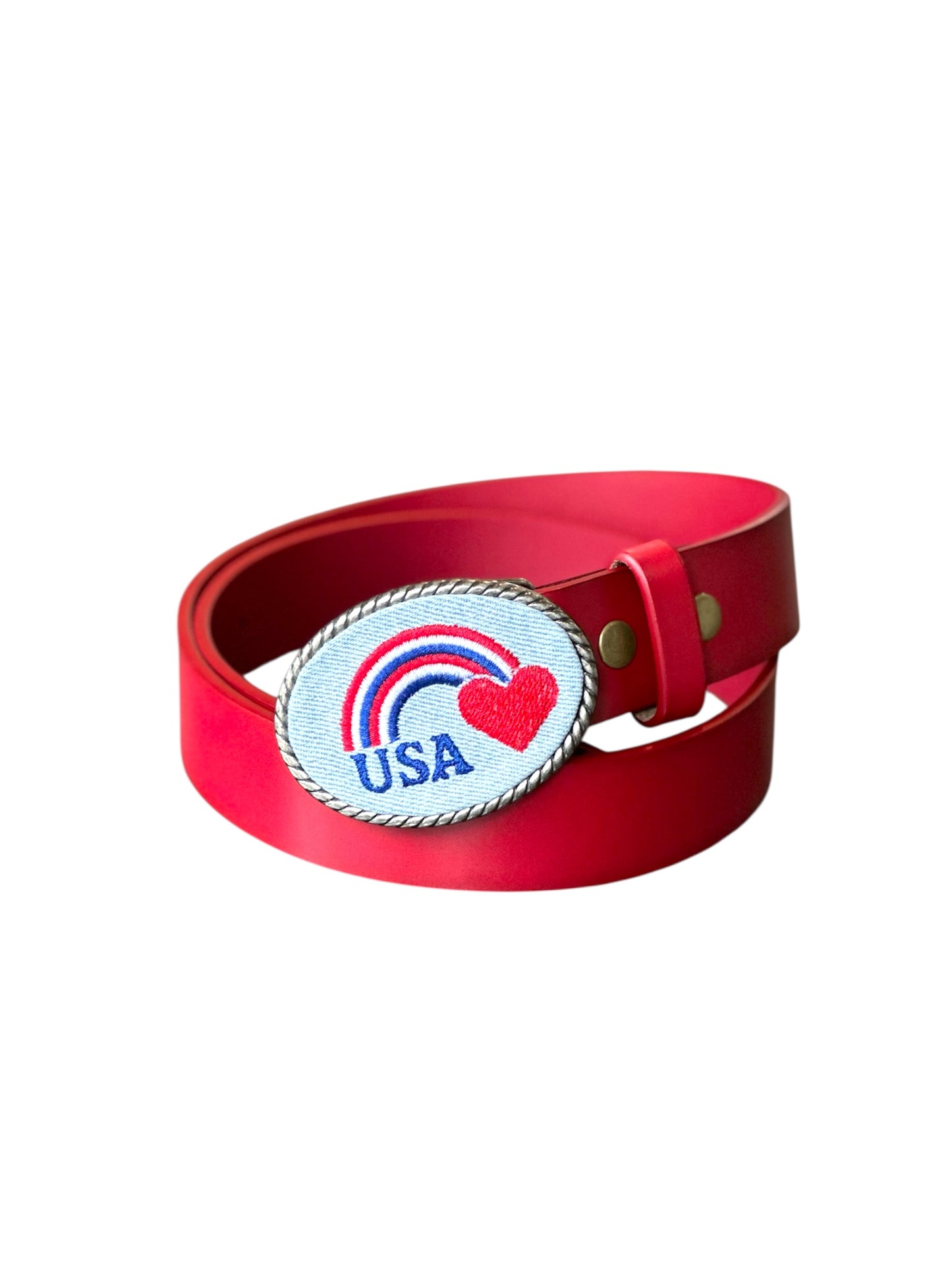 Red belt with a decorative denim buckle featuring a rainbow and heart  USA design on a white background