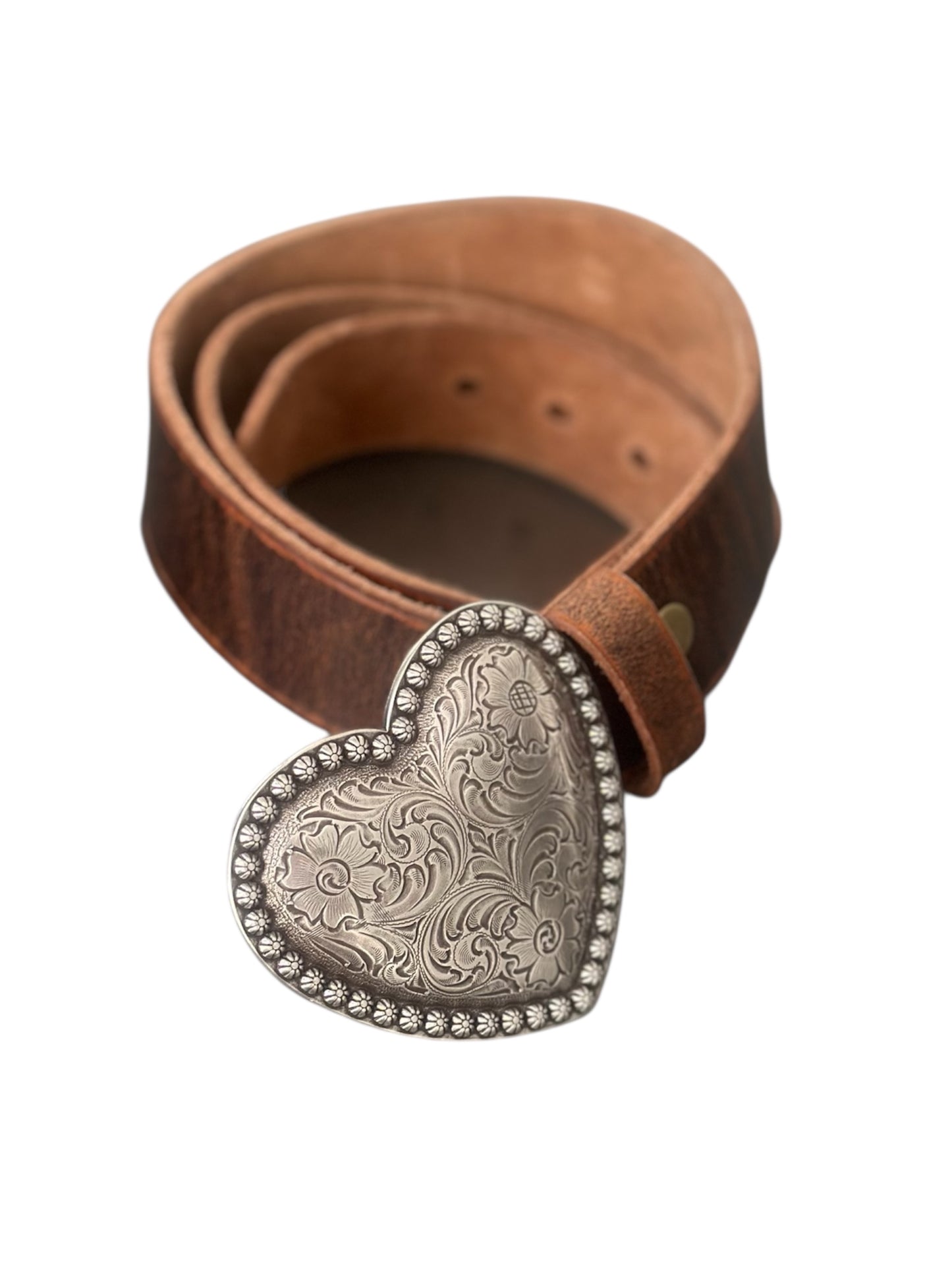 Brown leather belt with a silver heart-shaped buckle on a white background