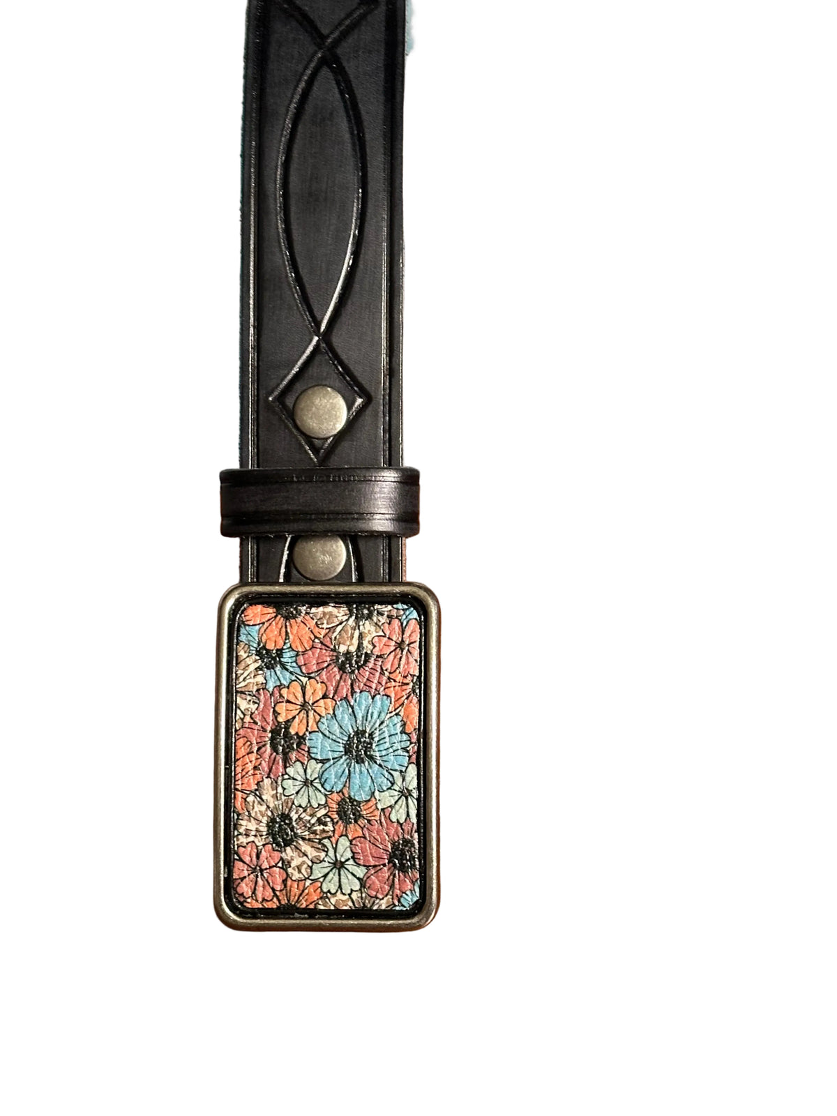 A black leather belt with a rectangular floral-patterned metal buckle on a white background. 